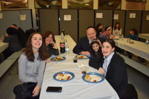 Happy Family Eating at cRc Chanuka Party