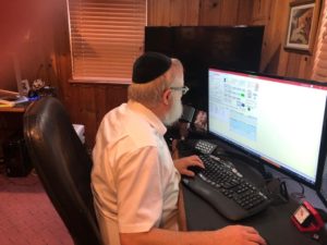 Rabbi Working on a Computer